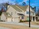 This home features a side-entry garage, a neutral color scheme and a well-kept lawn at 4188 Gunnerson Ln, Kennesaw, GA 30152