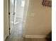 Hallway featuring gray tile floor and white doors and trim at 4188 Gunnerson Ln, Kennesaw, GA 30152