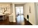 Long hallway with views of kitchen and sunroom at 4188 Gunnerson Ln, Kennesaw, GA 30152