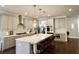 Spacious kitchen boasts modern gray cabinets, stainless steel appliances, and stylish pendant lighting at 4188 Gunnerson Ln, Kennesaw, GA 30152