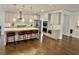 Bright kitchen features a large island with seating and pendant lighting, plus stainless steel appliances at 4188 Gunnerson Ln, Kennesaw, GA 30152