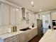 Well-lit kitchen features modern appliances, grey cabinets, and sleek countertops at 4188 Gunnerson Ln, Kennesaw, GA 30152