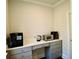 Convenient kitchen nook featuring cabinetry and desk space, ideal for small appliances and storage at 4188 Gunnerson Ln, Kennesaw, GA 30152