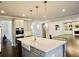 Bright kitchen featuring an island and stainless steel appliances with easy access to the living area at 4188 Gunnerson Ln, Kennesaw, GA 30152