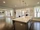 Open concept kitchen featuring a large island with seating and a view into the living area at 4188 Gunnerson Ln, Kennesaw, GA 30152