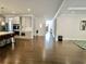 Spacious living room featuring hardwood floors, open floor plan, and stylish kitchen area at 4188 Gunnerson Ln, Kennesaw, GA 30152