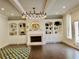 Charming living room features a fireplace, built-in shelving, and modern lighting at 4188 Gunnerson Ln, Kennesaw, GA 30152