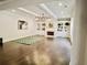 Bright living room with hardwood floors, fireplace, built-in shelves, and coffered ceiling at 4188 Gunnerson Ln, Kennesaw, GA 30152