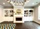 Elegant living room showcasing fireplace, built-in shelving, and hardwood floors at 4188 Gunnerson Ln, Kennesaw, GA 30152
