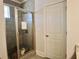 Tiled walk-in shower with a glass enclosure and a cat at 4188 Gunnerson Ln, Kennesaw, GA 30152
