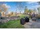 Grassy backyard with two grills on a patio and a tiered garden, perfect for outdoor entertaining and relaxation at 5835 Sterling Ct, Cumming, GA 30040