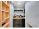 A well-organized bar area with custom shelving, stylish cabinets, and space for storing your favorite spirits at 5835 Sterling Ct, Cumming, GA 30040