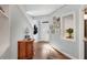 Light and airy entryway featuring hardwood floors, built-in shelving, and charming decor at 5835 Sterling Ct, Cumming, GA 30040