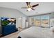 Bright main bedroom featuring a large bed, vaulted ceilings, and multiple windows for ample natural light at 5835 Sterling Ct, Cumming, GA 30040