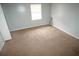 Cozy bedroom with carpet flooring, window with blinds, and freshly painted walls at 2660 Evans Ml, Lithonia, GA 30058