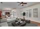 Open concept living room and dining area featuring hardwood floors and plentiful windows at 4192 Pelham Cir, Lithonia, GA 30038