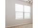 Bright bedroom featuring plush carpeting, neutral walls, and a large window at 4924 Rapahoe Trl, Atlanta, GA 30349
