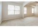 Bright bedroom featuring neutral walls, plush carpeting, and ample natural light at 4924 Rapahoe Trl, Atlanta, GA 30349