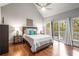 Bedroom featuring hardwood floors, ceiling fan, and access to a deck at 1255 Wildcliff Ne Pkwy, Atlanta, GA 30329