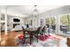 Open floor plan showcasing dining area with hardwood floors, a rug, and large windows at 1255 Wildcliff Ne Pkwy, Atlanta, GA 30329