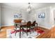 Formal dining area featuring hardwood floors, a patterned rug, and ample seating at 1255 Wildcliff Ne Pkwy, Atlanta, GA 30329