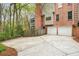 Long driveway leading to a two-car garage, showcasing the property's exterior and landscaping at 1255 Wildcliff Ne Pkwy, Atlanta, GA 30329