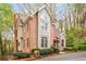 Brick home exterior featuring manicured shrubs and a brick mailbox in a wooded area at 1255 Wildcliff Ne Pkwy, Atlanta, GA 30329