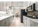 Modern kitchen with gray cabinets, stainless steel appliances, and granite countertops at 1255 Wildcliff Ne Pkwy, Atlanta, GA 30329