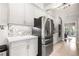 Bright kitchen featuring stainless steel appliances, light wood floors, and stone countertops and backsplash at 1255 Wildcliff Ne Pkwy, Atlanta, GA 30329