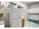 Organized pantry with ample shelving, white cabinets and a full size refrigerator at 1255 Wildcliff Ne Pkwy, Atlanta, GA 30329