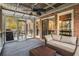 Relaxing screened porch with comfortable seating, ceiling fan, and views of the natural setting at 1255 Wildcliff Ne Pkwy, Atlanta, GA 30329