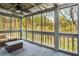 Inviting screened porch with full views of the serene wooded surroundings at 1255 Wildcliff Ne Pkwy, Atlanta, GA 30329
