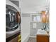 Bathroom with washer/dryer, bathtub and shower combo, vanity with sink, and natural light at 3048 Briarcliff Ne Rd # 2, Atlanta, GA 30329