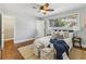 Bright bedroom featuring hardwood floors, neutral walls, a ceiling fan and natural light at 3048 Briarcliff Ne Rd # 2, Atlanta, GA 30329