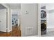 Hallway next to the bathroom with stacked washer and dryer and a glimpse of the living room at 3048 Briarcliff Ne Rd # 2, Atlanta, GA 30329
