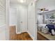 Hallway view into the bedroom, featuring hardwood floors and neutral paint at 3048 Briarcliff Ne Rd # 2, Atlanta, GA 30329