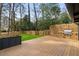 Deck and backyard with a grill, green grass and wood fencing at 3637 Eaglerock Dr, Atlanta, GA 30340