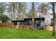 Backyard with a deck, grass and mature trees at 3637 Eaglerock Dr, Atlanta, GA 30340