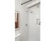 Modern shower with a rainfall showerhead, built-in niche, and sleek white tile, designed for relaxation and luxury at 3637 Eaglerock Dr, Atlanta, GA 30340