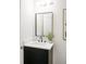 Elegant half bathroom with a modern sink, matte black faucet, and sleek black cabinet, with art on the wall at 3637 Eaglerock Dr, Atlanta, GA 30340