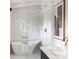 Stylish bathroom showcasing a freestanding tub within a glass-enclosed shower, complemented by modern fixtures at 3637 Eaglerock Dr, Atlanta, GA 30340