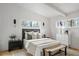 Bright bedroom with wood paneling, and soft, neutral-toned décor, with a bed and dresser at 3637 Eaglerock Dr, Atlanta, GA 30340