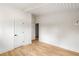 Bright bedroom with hardwood floors, white walls and ceilings, showcasing a minimalist and modern aesthetic at 3637 Eaglerock Dr, Atlanta, GA 30340