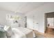 Bright bedroom with light-colored wood ceiling beams and a small window at 3637 Eaglerock Dr, Atlanta, GA 30340