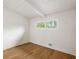 Bright bedroom with hardwood floors, white walls, a large window, and white ceilings, offering a clean design at 3637 Eaglerock Dr, Atlanta, GA 30340