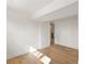 Finished basement bedroom featuring light hardwood flooring, white walls and trim, and ample sunlight at 3637 Eaglerock Dr, Atlanta, GA 30340