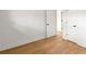 Bright bedroom with hardwood floors, white walls and trim, and white doors with black hardware at 3637 Eaglerock Dr, Atlanta, GA 30340