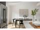 Bright dining area featuring modern art and sleek, black dining furniture at 3637 Eaglerock Dr, Atlanta, GA 30340