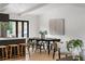 Open dining area with light wood floors, a large table and stylish decor at 3637 Eaglerock Dr, Atlanta, GA 30340