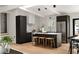 Modern kitchen with dark cabinets, stainless steel appliances, and center island at 3637 Eaglerock Dr, Atlanta, GA 30340